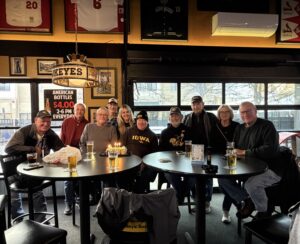 Group of regular customers at Coach's Corner celebrating a birthday