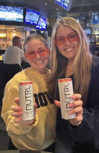 Coach's Corner owner and guest enjoying a drink